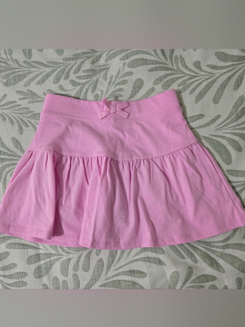 2 Place Girls' Light Pink Ruffled Skirt with Bow